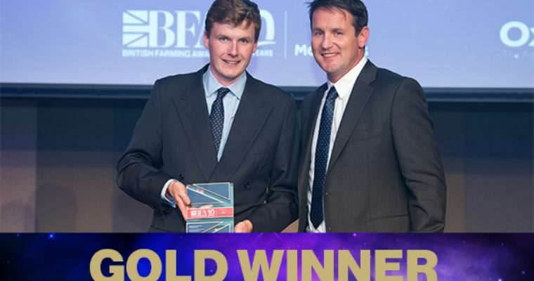 Two men holding an award for Arable Farmer of the Year - Gold Winner